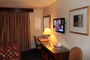 Picture of TV and table chair in room